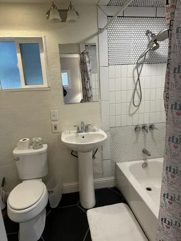 a view of a livingroom with furniture and windows