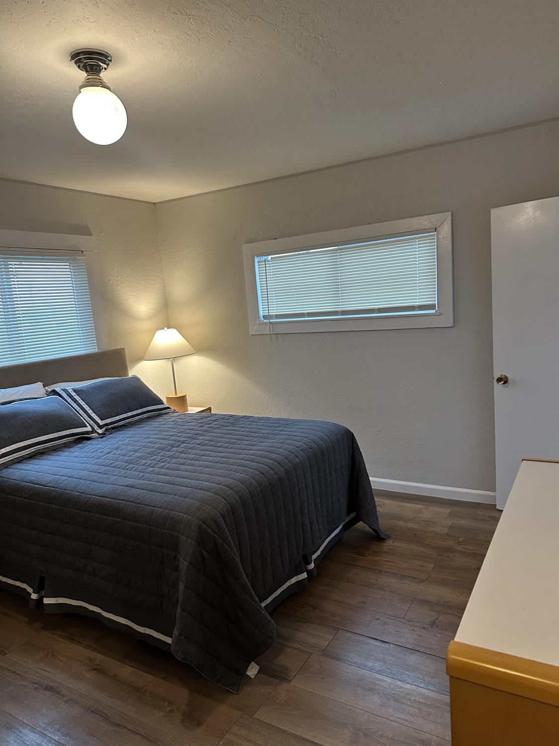 7271 Elk Grove Florin Road Sacramento, CA 95829 - Photo 38 of 49 a bedroom with a bed and lamp