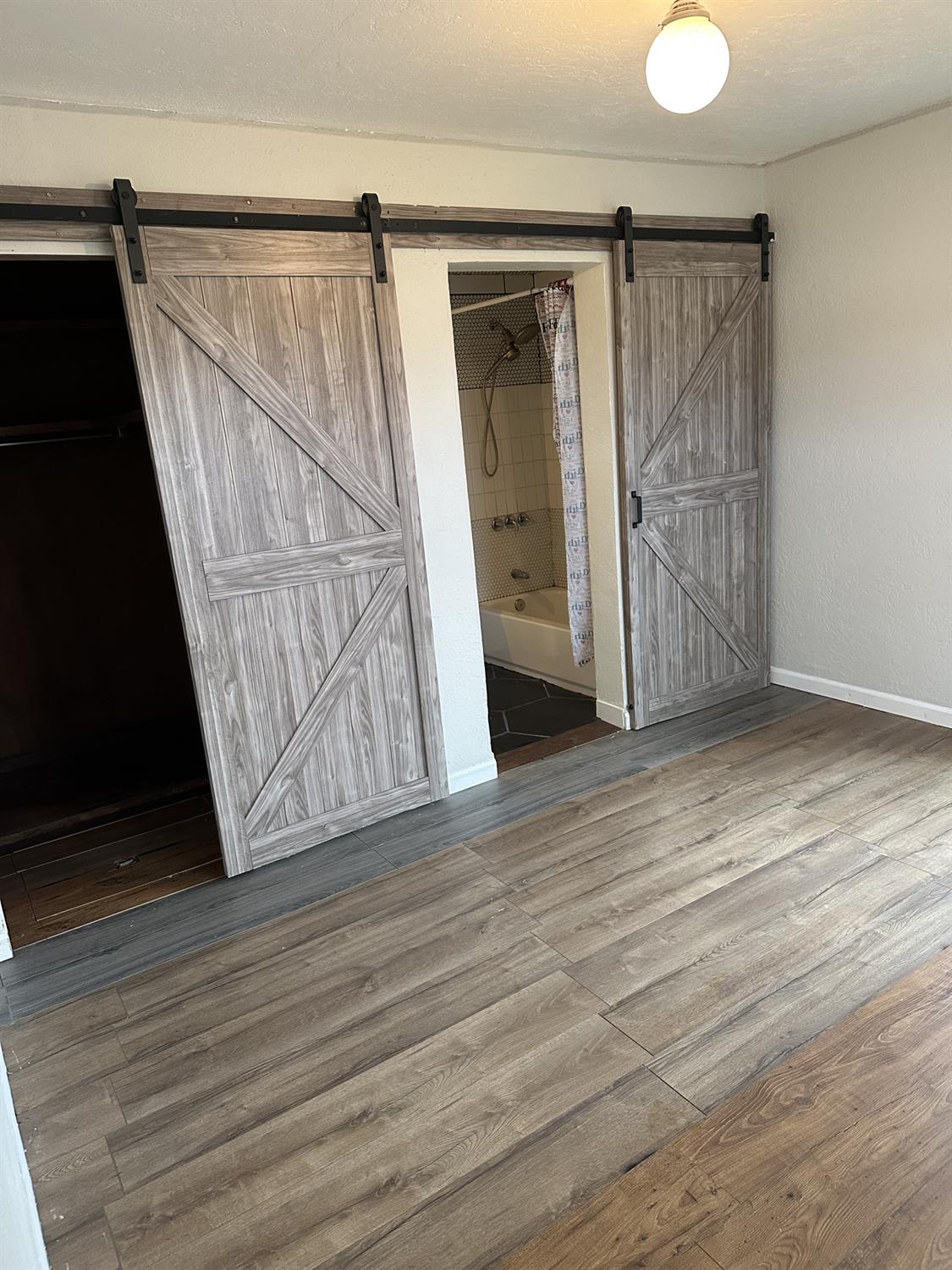 7271 Elk Grove Florin Road Sacramento, CA 95829 - Photo 43 of 49 a view of an empty room with wooden floor and a window