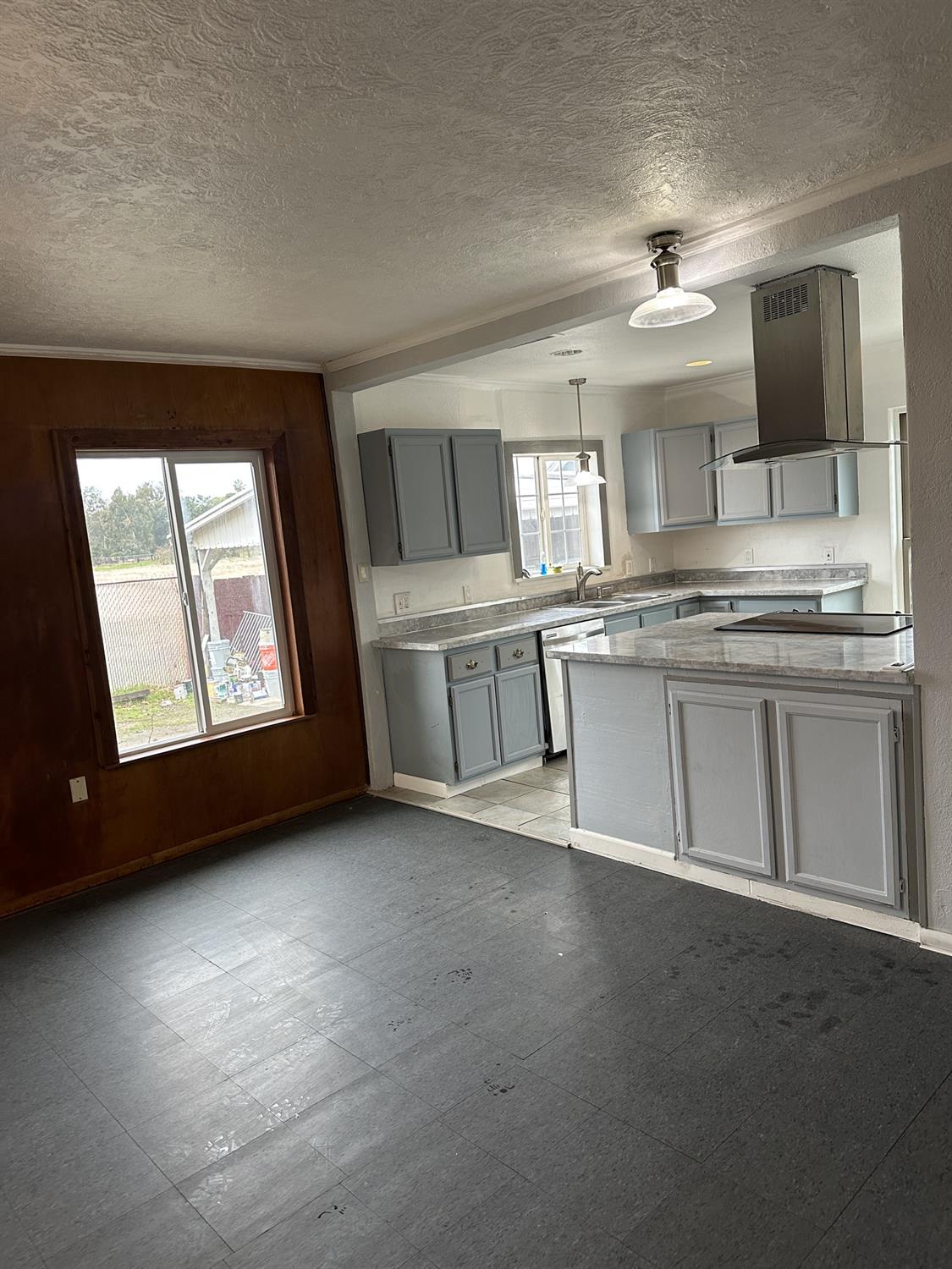 7271 Elk Grove Florin Road Sacramento, CA 95829 - Photo 49 of 49 a kitchen with stainless steel appliances granite countertop a stove a sink and a microwave