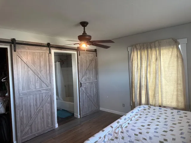 a kitchen with stainless steel appliances wooden cabinets and a stove top oven