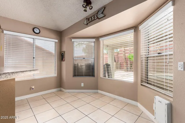 a view of a kitchen with stainless steel appliances granite countertop a refrigerator and a sink