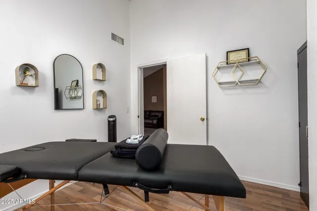 a view of workspace with furniture and a ceiling fan