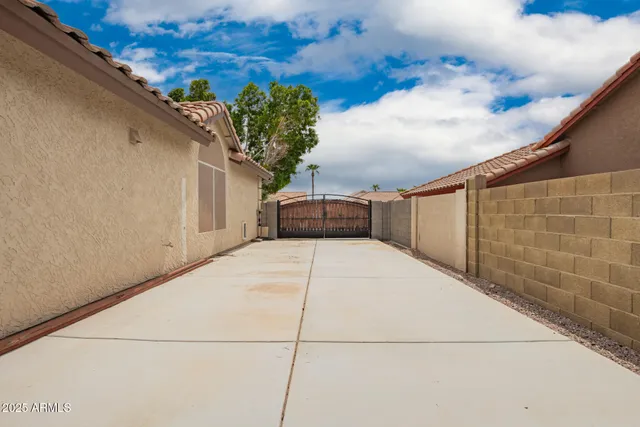 a view of a swimming pool with an outdoor seating