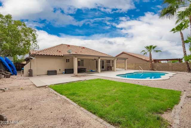 a house with a yard and a large parking space