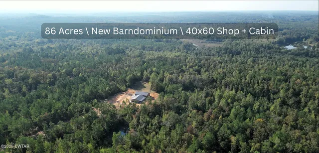 a sign that is sitting in the middle of a field