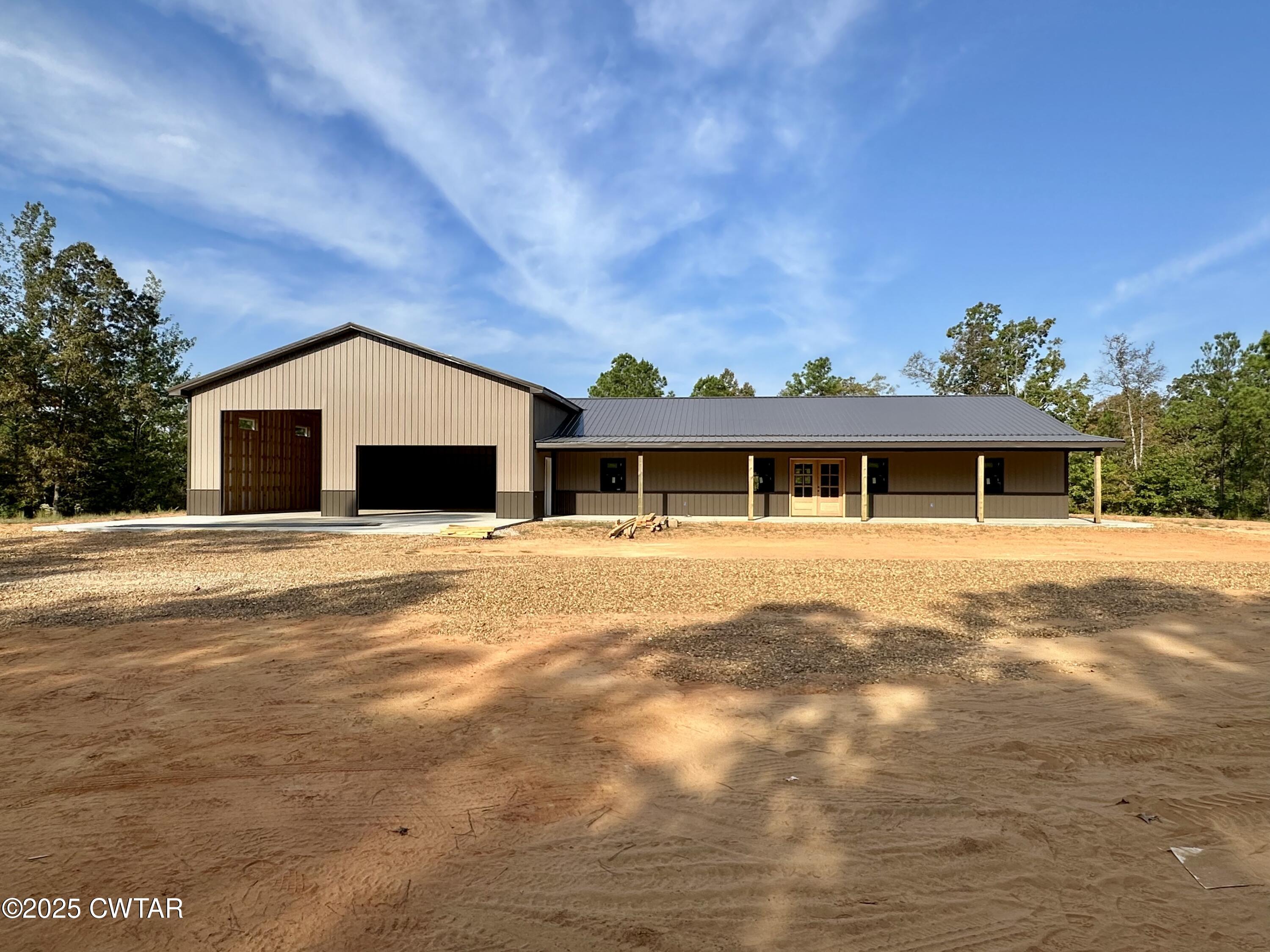 1137 Arl Bailey Road Finger, TN 38334 - Photo 2 of 40 a front view of a house with a yard