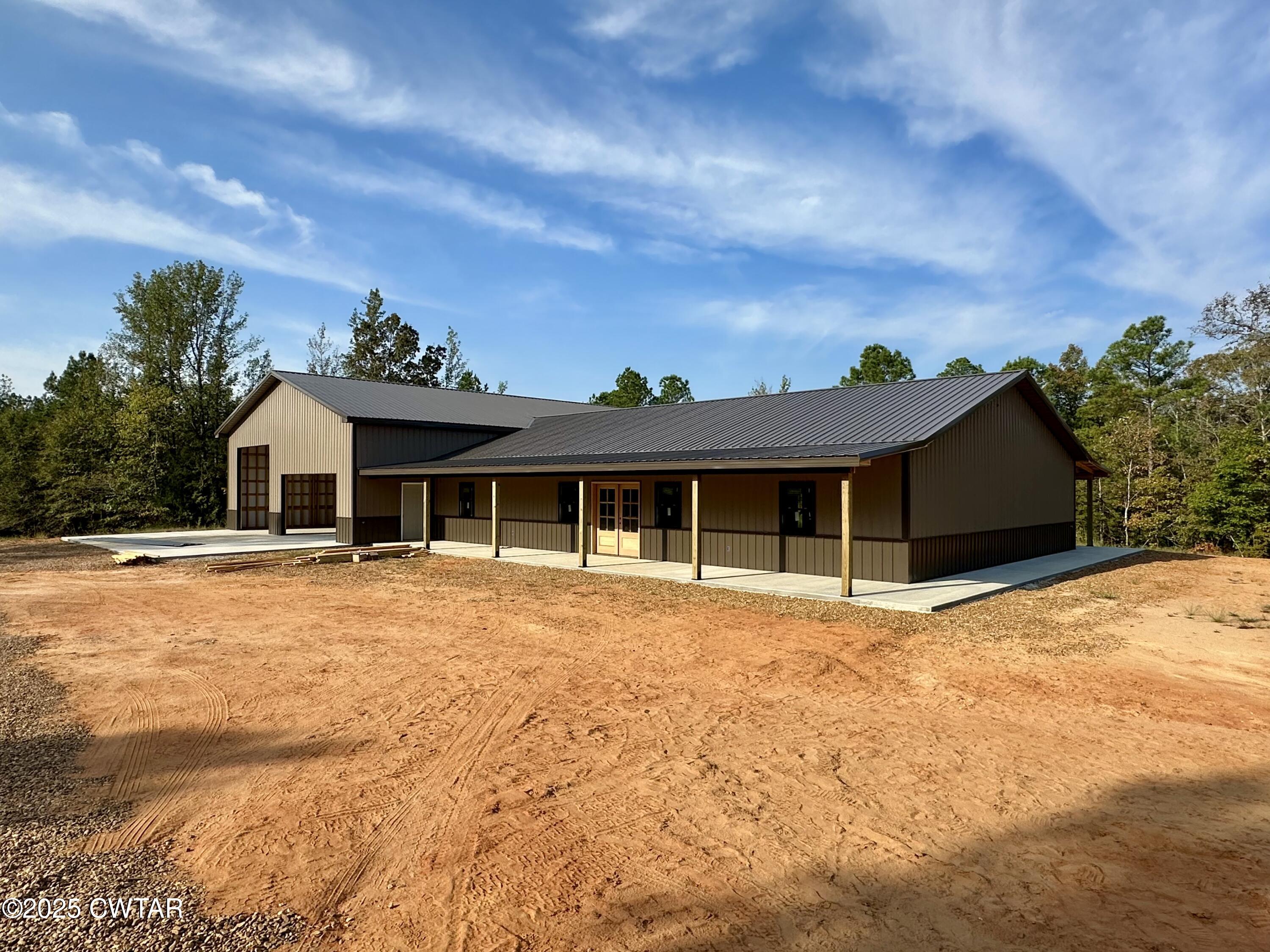 1137 Arl Bailey Road Finger, TN 38334 - Photo 3 of 40 a front view of a house with a yard