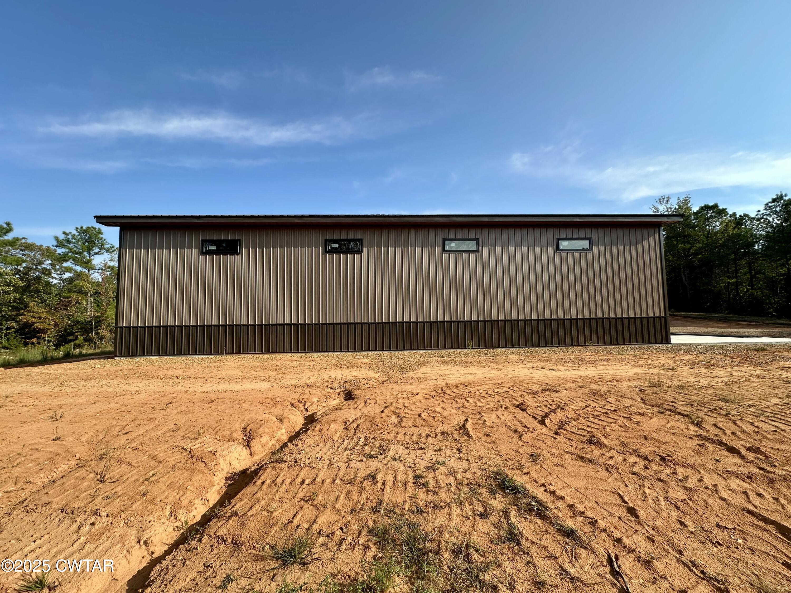 1137 Arl Bailey Road Finger, TN 38334 - Photo 5 of 40 a view of wooden fence and a building