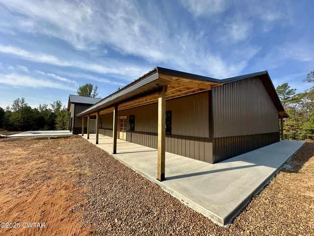 a view of outdoor space and front view of a house