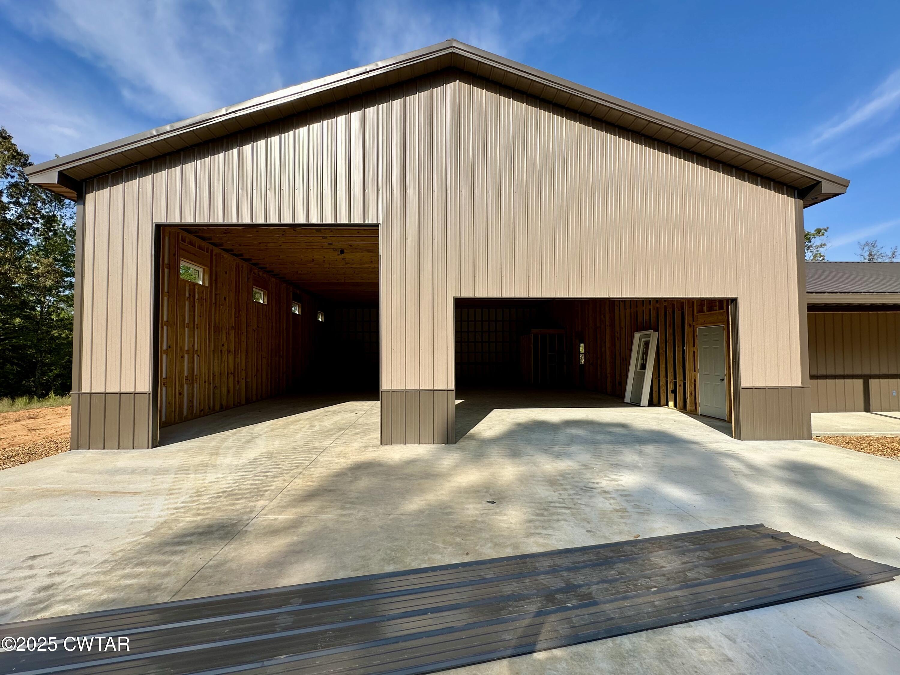 1137 Arl Bailey Road Finger, TN 38334 - Photo 9 of 40 a front view of a house with a yard