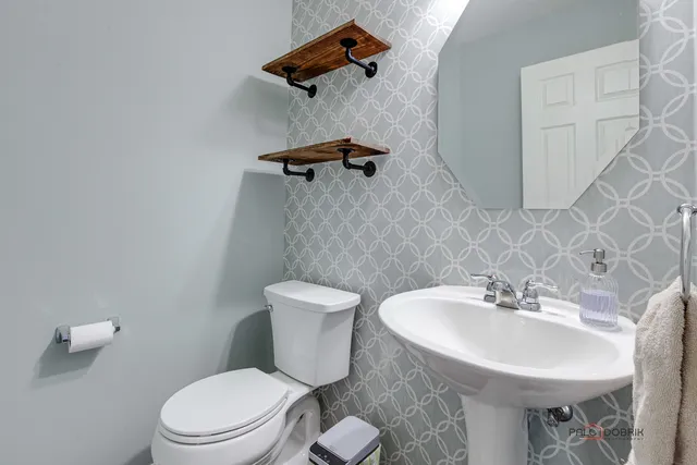 a bedroom with a bed and a ceiling fan