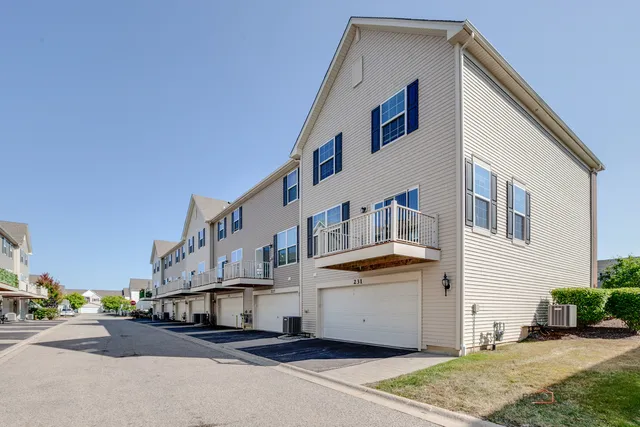 a view of residential houses with outdoor space