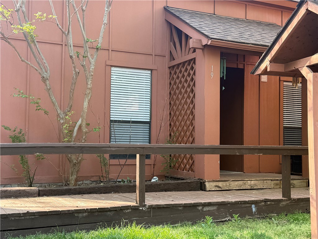 View of home's exterior featuring roof with shingl