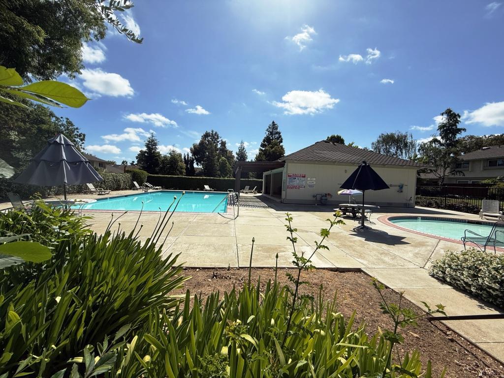20072 Northcrest Square Cupertino, CA 95014 - Photo 20 of 26 a view of a swimming pool with an outdoor space and seating area
