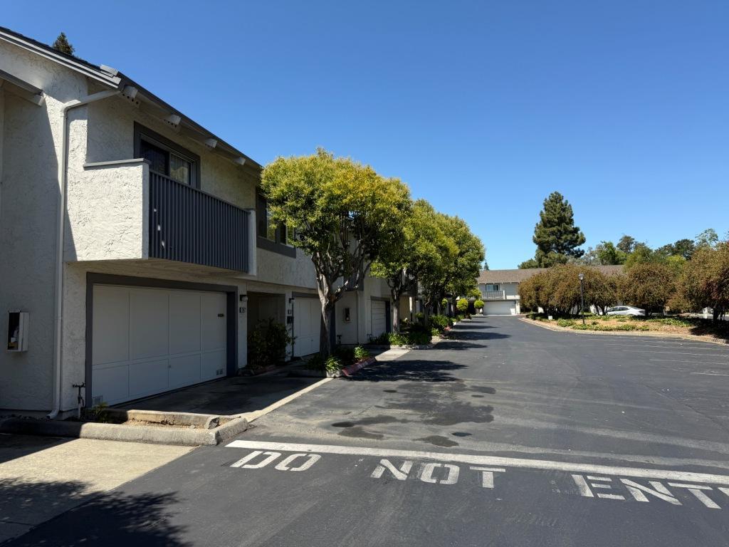 20072 Northcrest Square Cupertino, CA 95014 - Photo 26 of 26 a backyard of a house with plants and trees