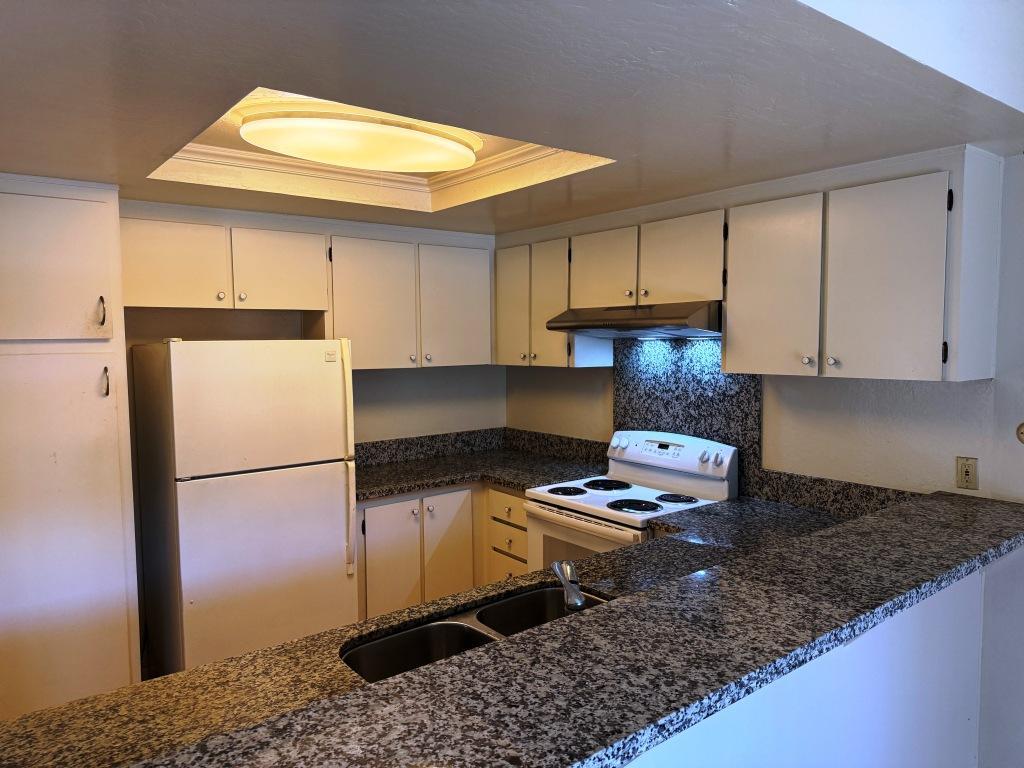 20072 Northcrest Square Cupertino, CA 95014 - Photo 7 of 26 a kitchen with granite countertop a refrigerator a stove a sink dishwasher and a refrigerator
