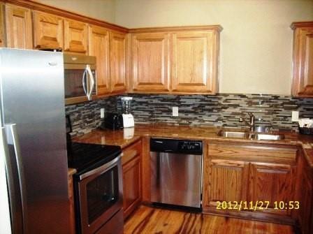 545 Melbourne Trail Graford, TX 76449 - Photo 3 of 8 a kitchen with granite countertop a stove and cabinets