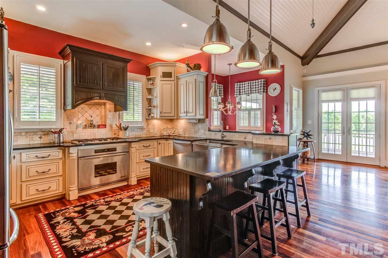 703 Kirk Adams Road Angier, NC 27501 - Photo 11 of 25 Lovely kitchen with honed countertops, top of the line appliances, and secret storage!
