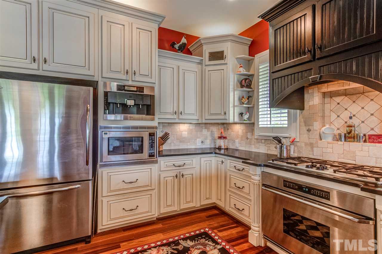 703 Kirk Adams Road Angier, NC 27501 - Photo 12 of 25 Beautiful Tile backsplash and see that above the Microwave? It's a BUILT IN COFFEE MAKER and it conveys!