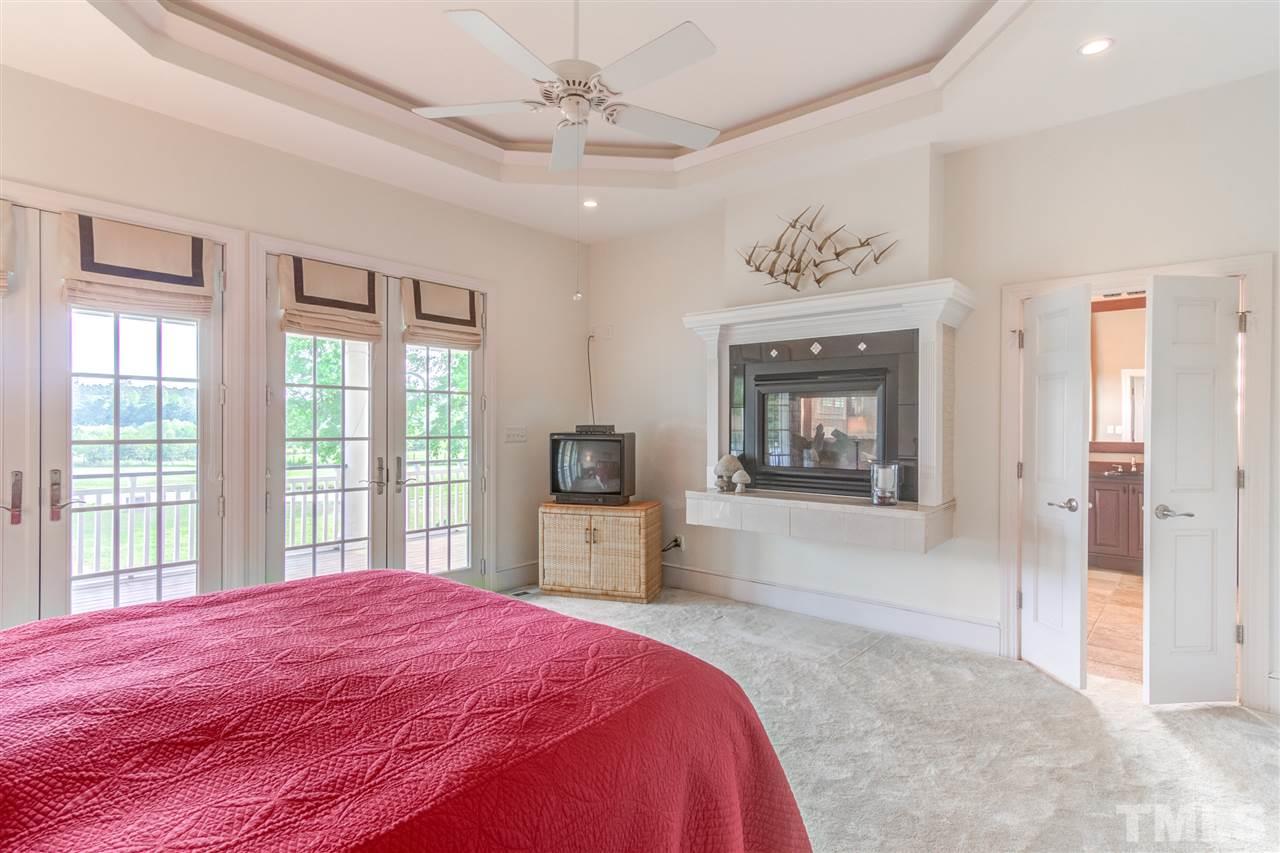 703 Kirk Adams Road Angier, NC 27501 - Photo 17 of 25 Stay warm and cozy on those cold nights with the two sided fireplace!