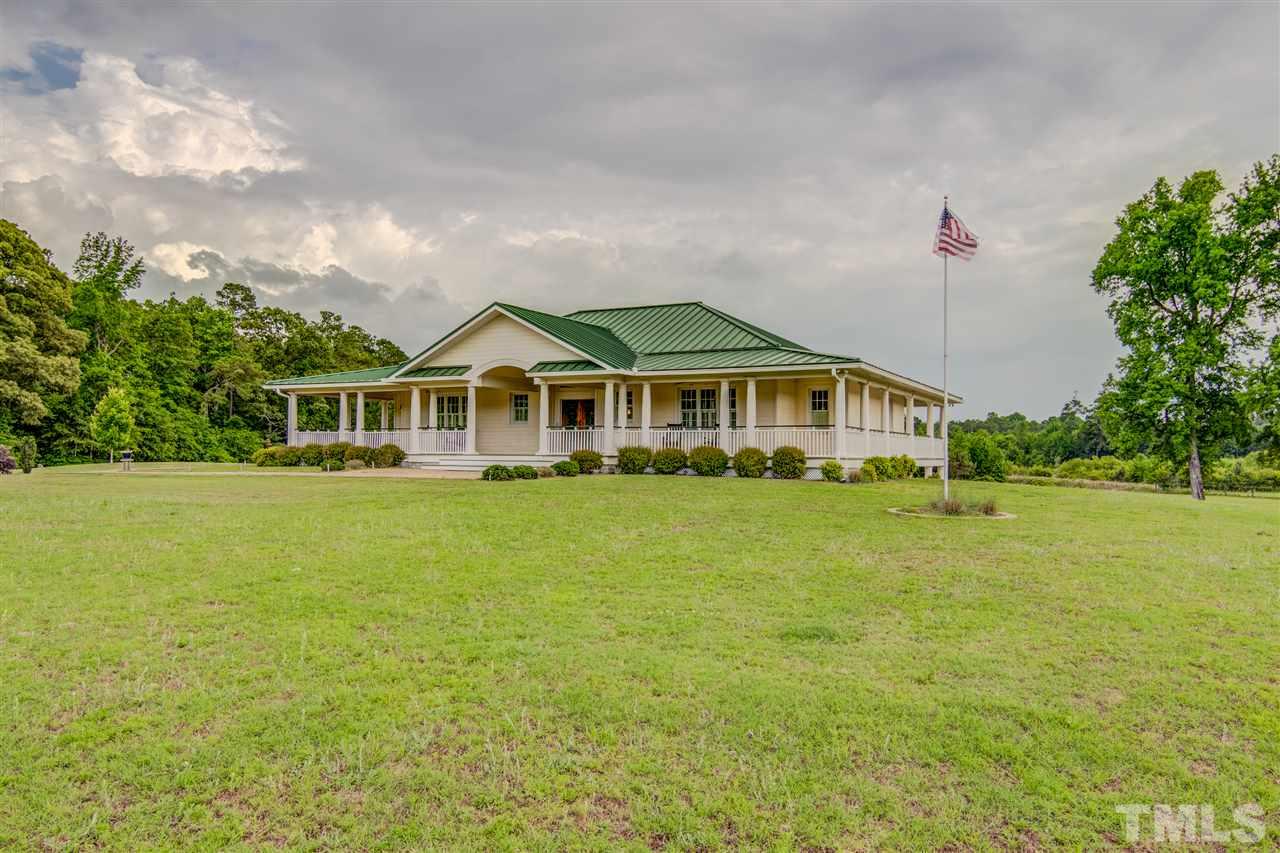 703 Kirk Adams Road Angier, NC 27501 - Photo 3 of 25 This beautiful home sits in the middle of 14.8 acres of mostly flat land.