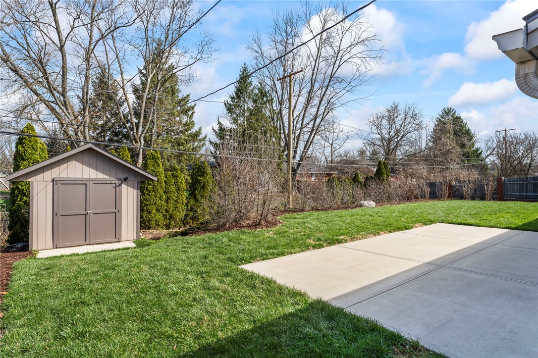2247 East Whipp Road Dayton, OH 45440 - Photo 48 of 52 This spacious yard features lush green grass and a convenient storage shed.