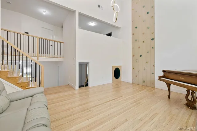 a view of a hallway with stairs