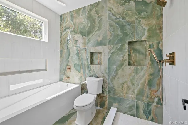 a spacious bedroom with a bed and a window