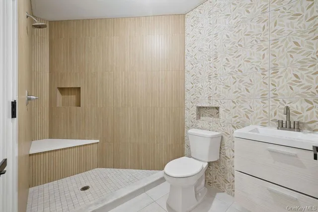 a bedroom with two beds and large window