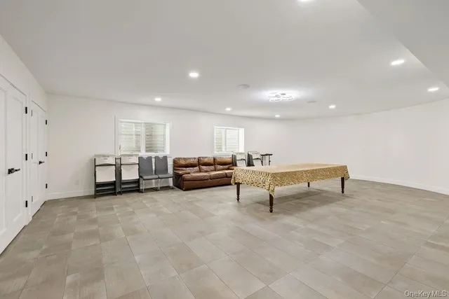 a white toilet sitting next to a bathroom and a shower curtain