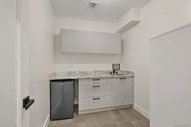 a bedroom with two beds and a window