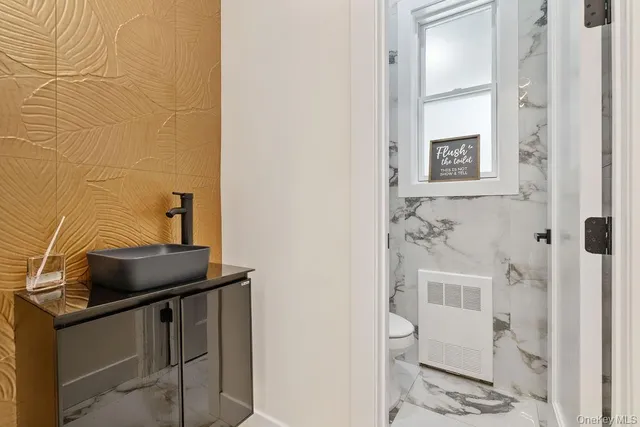 a dining room with furniture and a window