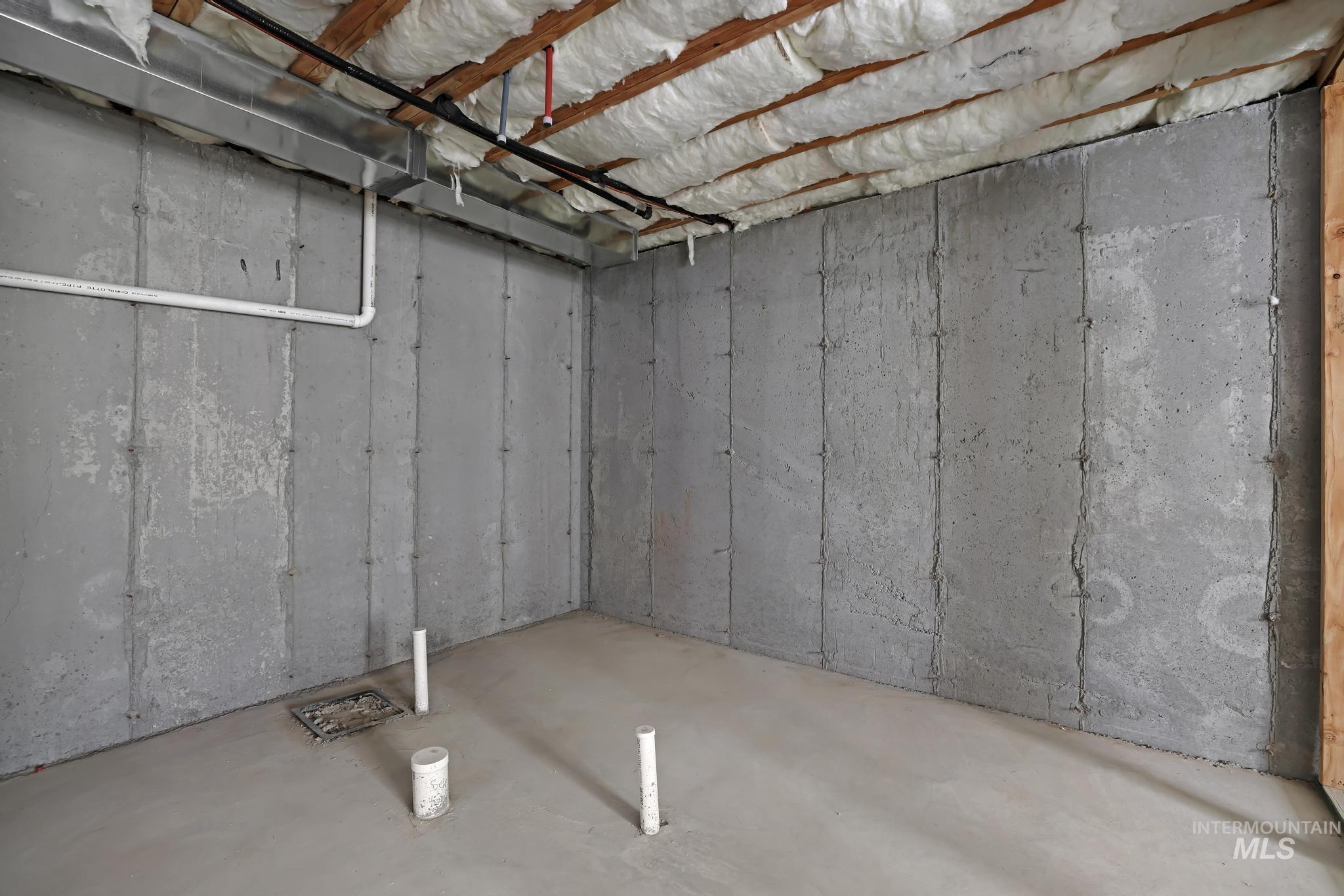 866 Quartz Road Kimberly, ID 83341 - Photo 38 of 48 Unfinished basement featuring concrete walls and flooring, exposed ceiling joists with insulation, and visible utility lines
