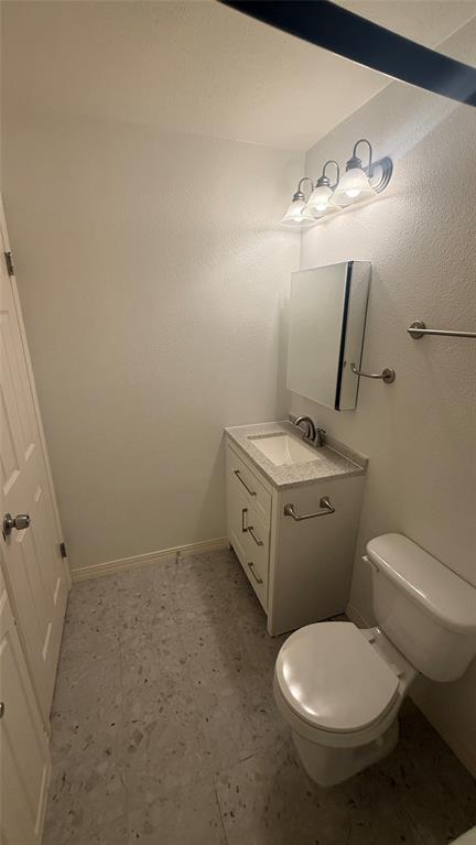 500 East Riverside Drive, Unit 132 Austin, TX 78704 - Photo 16 of 31 a white toilet sitting next to a bathroom sink