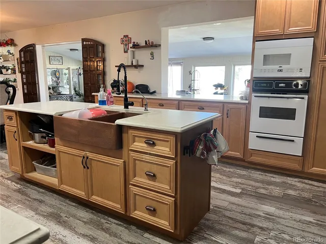 a kitchen with stainless steel appliances granite countertop a stove and a sink