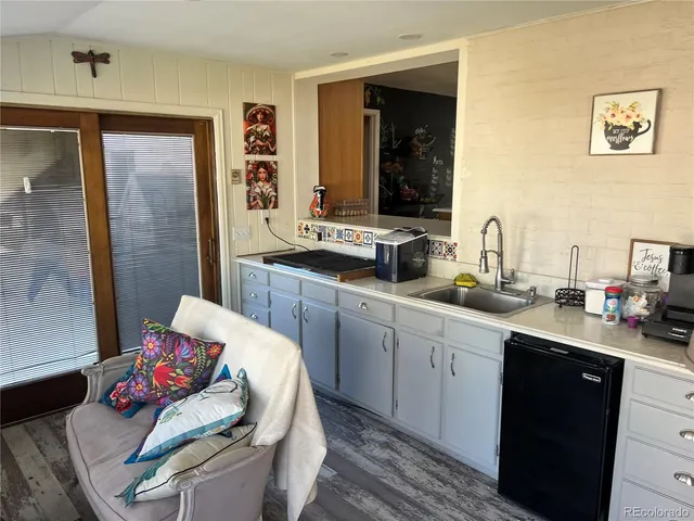 a kitchen with stainless steel appliances a sink and a refrigerator