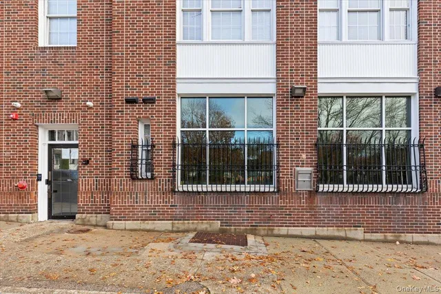 a view of a brick house with a window