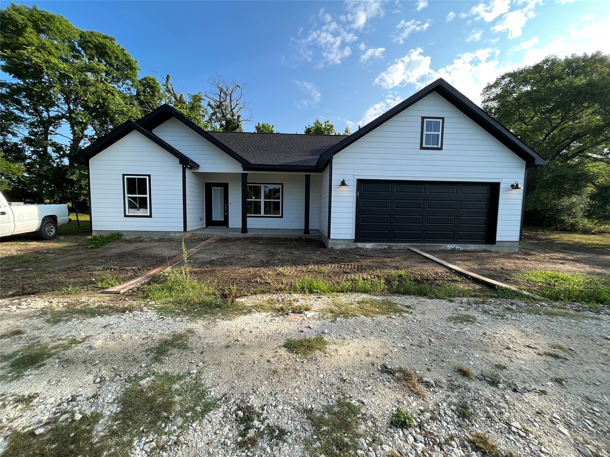 front view of a house with a yard