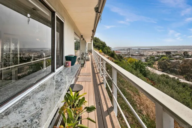 a view of balcony with furniture