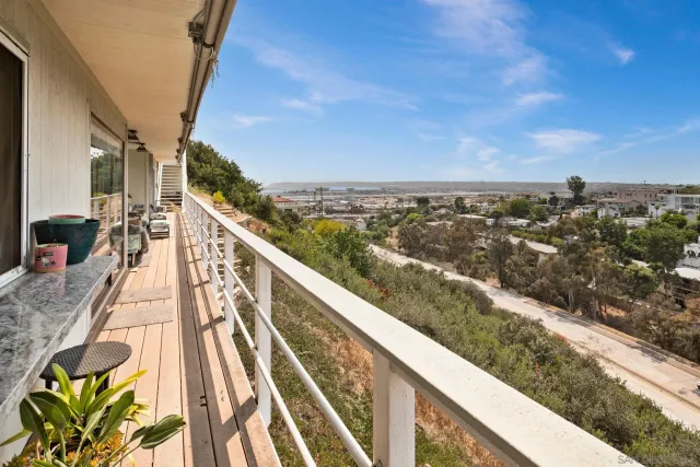 a view of balcony with furniture