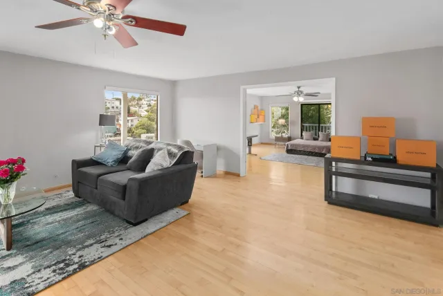 a living room with furniture and a large window