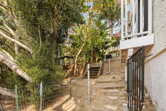 a backyard of a house with table and chairs