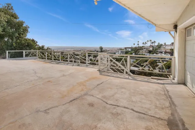 a view of a terrace with wooden fence