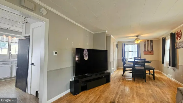 a kitchen with a stove top oven cabinets and a window