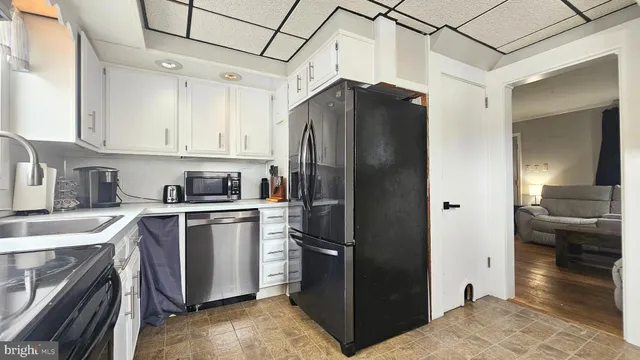 a view of a dining room with furniture and window