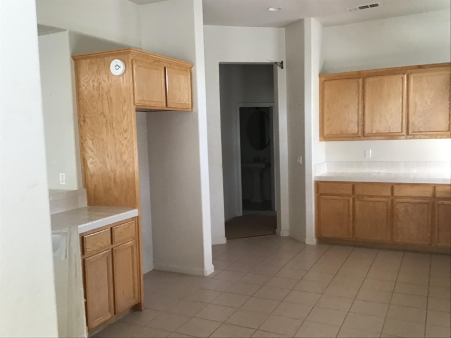 205 Quail Meadow Lane Copperopolis, CA 95228 - Photo 14 of 27 a view of a kitchen with cabinets