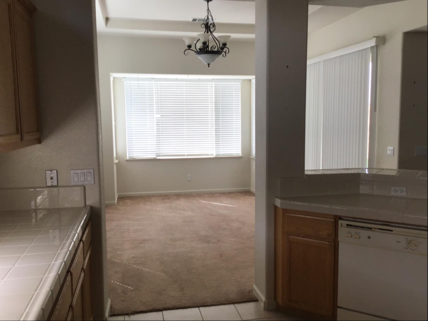 205 Quail Meadow Lane Copperopolis, CA 95228 - Photo 17 of 27 a kitchen with a sink stove and cabinets
