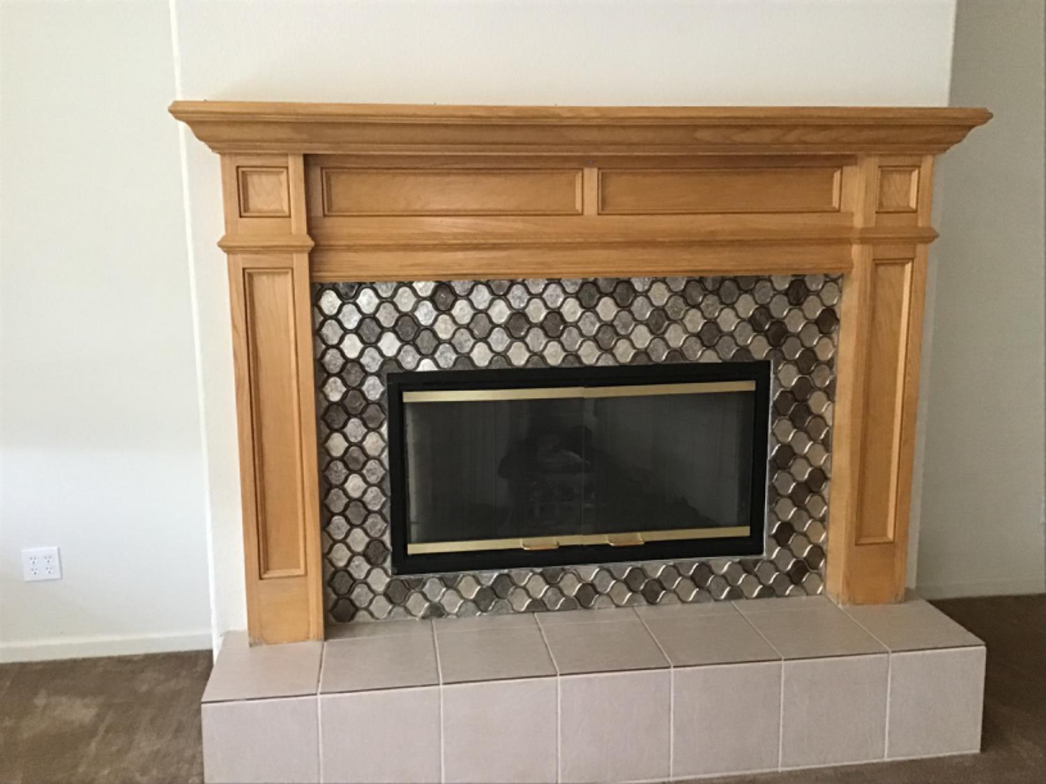 205 Quail Meadow Lane Copperopolis, CA 95228 - Photo 20 of 27 a fireplace with a stove