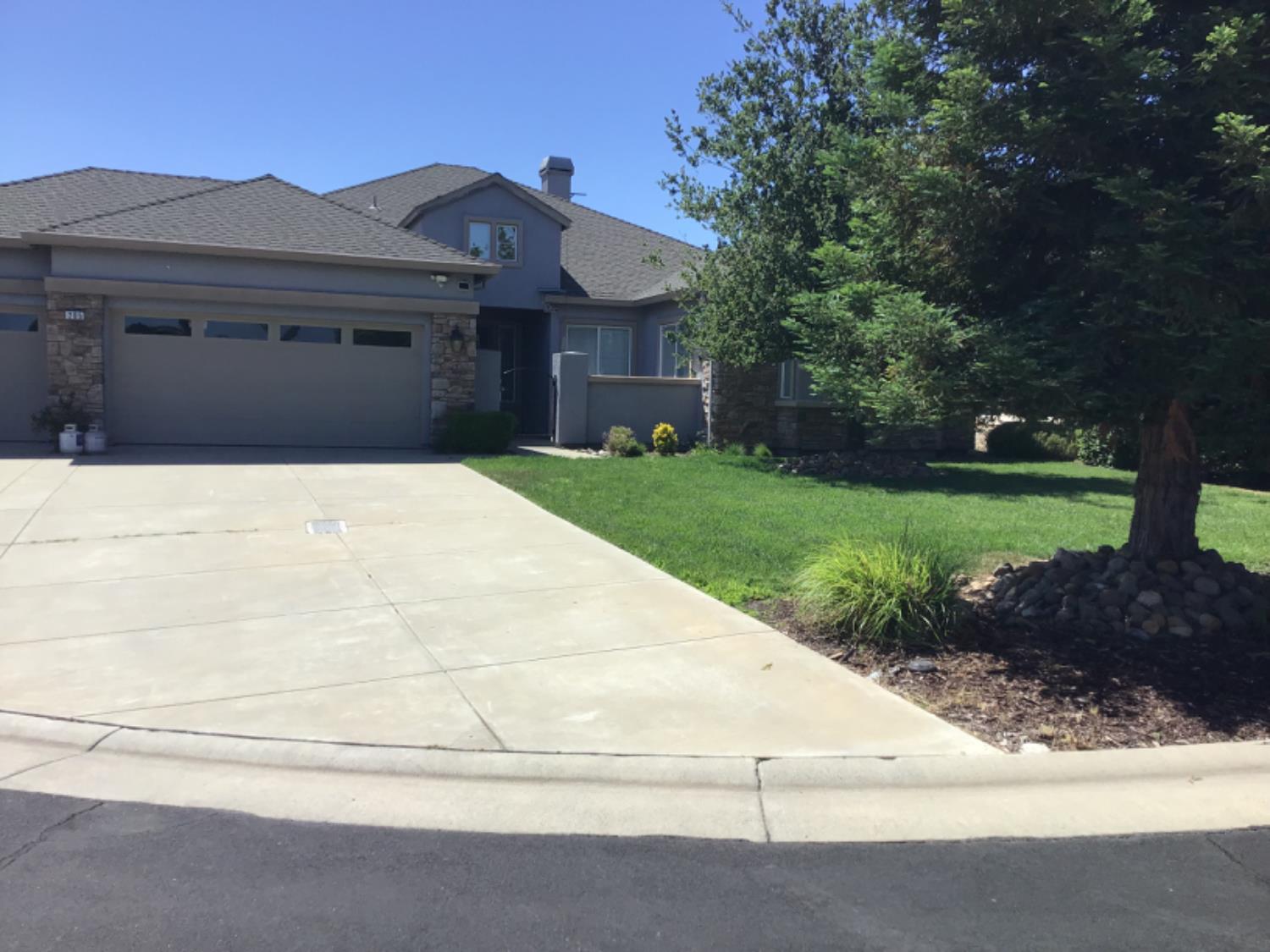205 Quail Meadow Lane Copperopolis, CA 95228 - Photo 2 of 27 a front view of a house with a yard